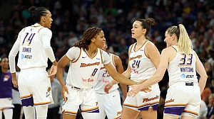 Members of the Phoenix Mercury celebrate against the Minnesota Lynx in the third quarter during Game Two of the WNBA Semifinals at Target Center on September 23, 2025 in Minneapolis, Minnesota. The Mercury defeated the Lynx 89-83 in overtime.