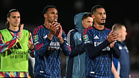 X/Arsenal : Arsenal players applaud the travelling support at ful-time.