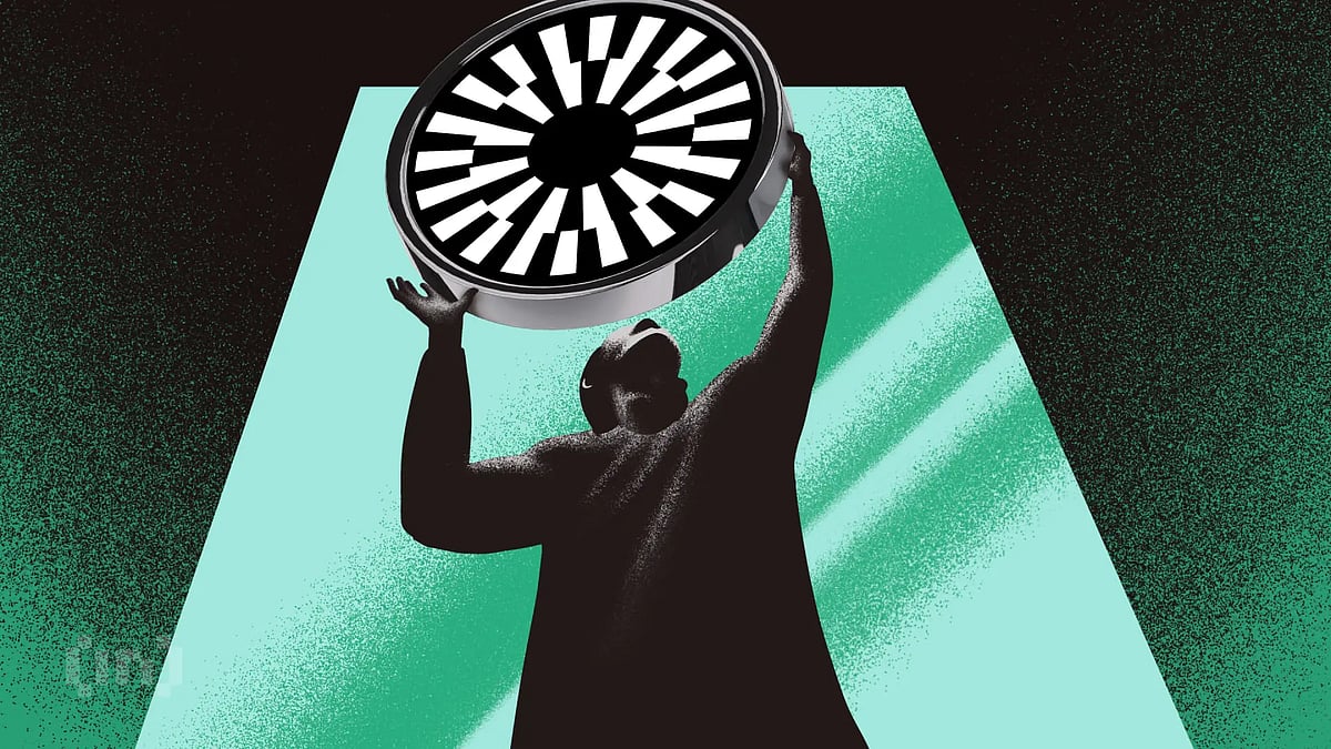 Person holding a circular futuristic object against a blue and black background.