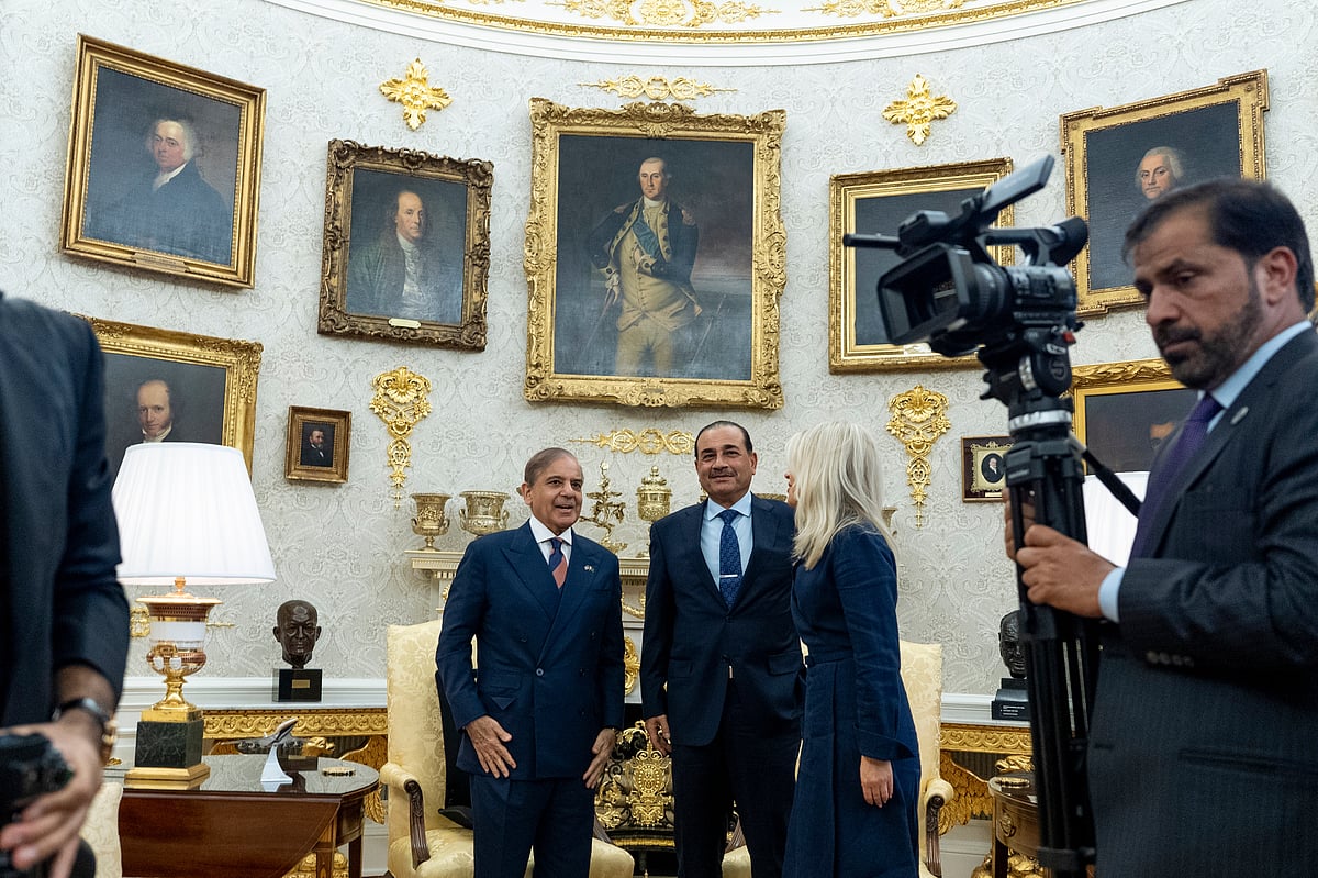 Pakistan Prime Minister Muhammad Shehbaz Sharif, left, and Gen. Syed Asim Munir wait for their meeting with President Donald Trump, in the Oval Office at the White House, Thursday, Sept. 25, 2025, in Washington. - Alex Brandon/AP