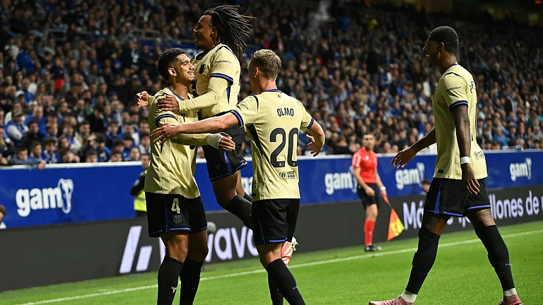 Ronald Araujo celebrates with his teammates after scoring for FC Barcelona against Real Oviedo in the La Liga 2025-26. - null