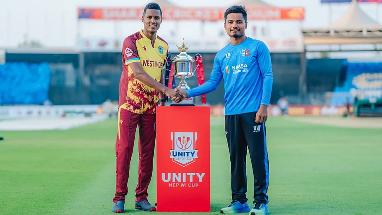 West Indies captain Akeal Hosein and Nepal captain Rohit Paudel with the bilateral series tropy ahead of the first T20I match on September 27. - | Photo: X/CricketNep