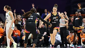 Kathryn Westbeld #24 of the Phoenix Mercury celebrates with Kahleah Copper #2 after a three-point shot against the Minnesota Lynx during the first half of Game Three of the 2025 WNBA Playoffs semifinals at PHX Arena on September 26, 2025 in Phoenix, Arizona.