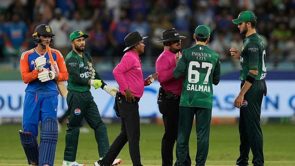 AP/Altaf Qadri     : Umpires mediate between India's players Abhishek Sharma, Shubman Gill and Pakistani players Pakistan's Haris Rauf