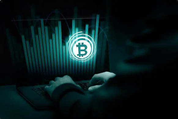Bitcoin symbol with financial data, person at computer
