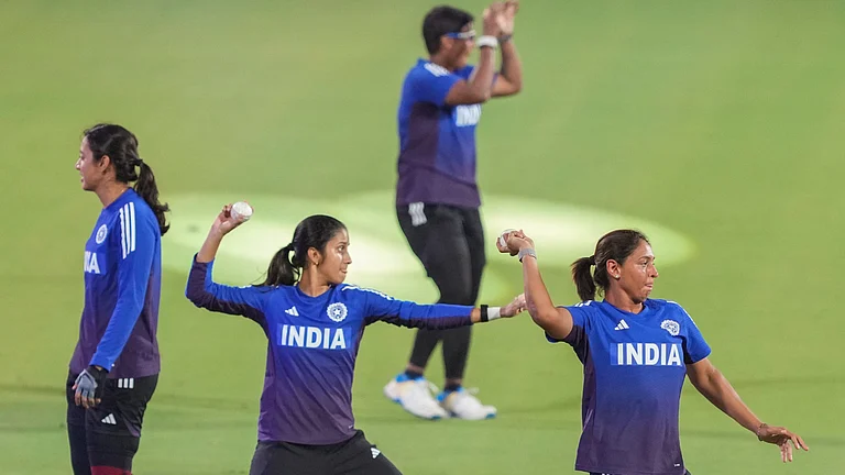 India's captain Harmanpreet Kaur with teammates during a training session ahead of the ICC Women's Cricket World Cup 2025 match against Sri Lanka in Guwahati. - PTI/Swapan Mahapatra