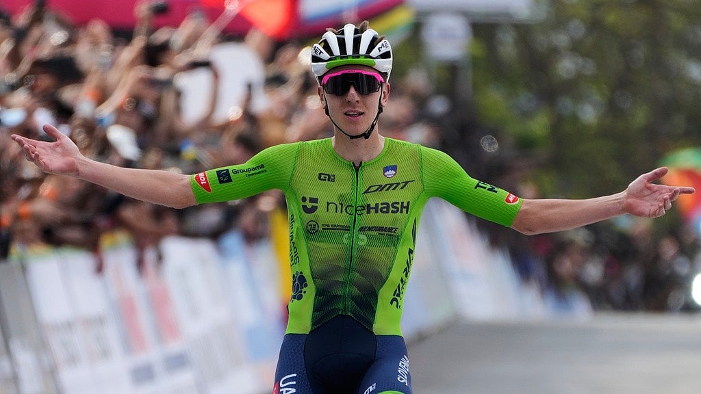 AP/Jerome Delay : Slovenia's Tadej Pogacar celebrates winning the men's Elite road race, at the road cycling World Championships in Kigali, Rwanda, Sunday, Sept. 28, 2025