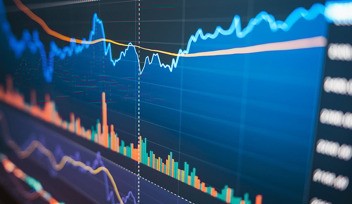 Close-up of a digital stock or crypto chart on a screen showing price action and volume data