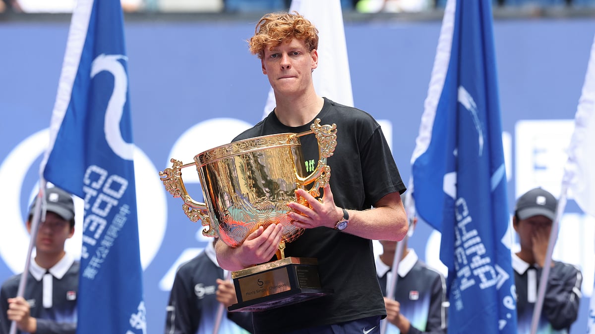 Jannik Sinner poses with the China Open trophy