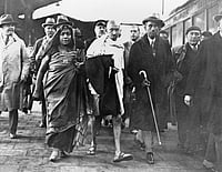 Walking with Gandhi: Feminist Footsteps In A Conflicted World CreditIMAGO / GRANGER Historical Picture Archive
: MOHANDAS GANDHI (1869-1948). With poet Sarojini Naidu en-route to the Second Round Table Conference in London, England. Photograph, 1931