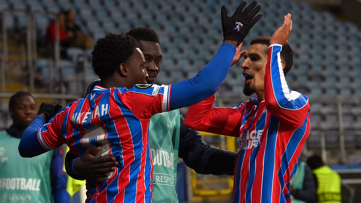 Eddie Nketiah celebrates his goal with Daniel Munoz and Ismaila Sarr