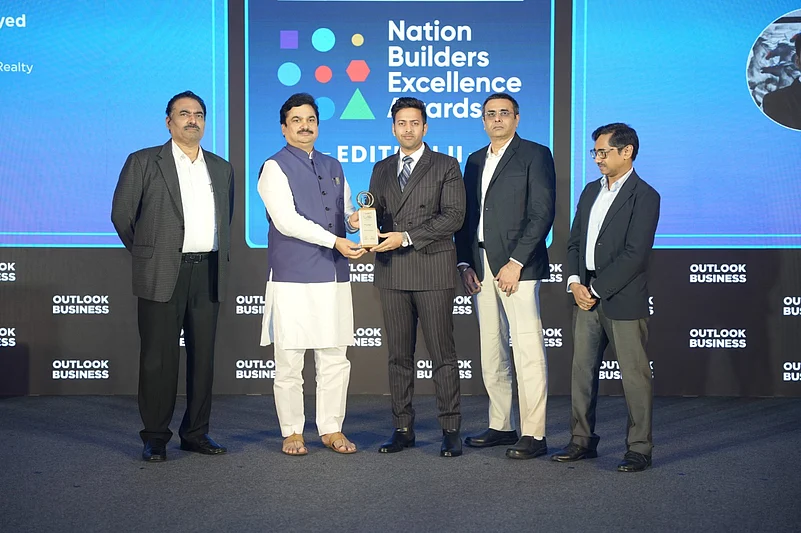 Mazhar Sayed, Director, AsmitA India Realty receiving an award