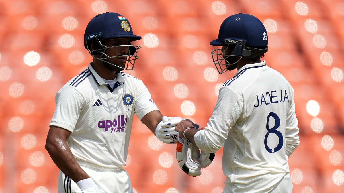 (AP Photo/Ajit Solanki) : India Vs West Indies Cricket LIVE Score, 1st Test Day 2: India's Ravindra Jadeja, right, and Dhruv Jurel greets each other on the second day of the first Test cricket match between India and West Indies at Narendra Modi Stadium in Ahmedabad, India, Friday, Oct. 3, 2025.