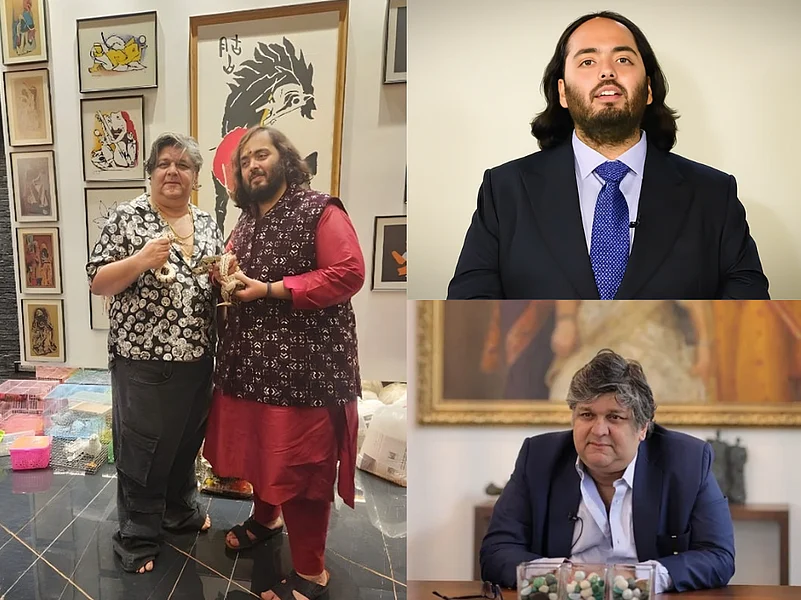 Bharat Mehra & Anant Ambani standing together, holding award