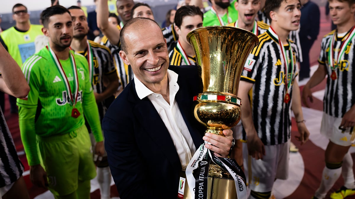 File : File photo of Juventus manager Massimiliano Allegri with the Coppa Italia trophy.