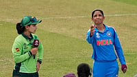 AP : India's captain Harmanpreet Kaur, right, tosses a coin as Pakistan's captain Fatima Sana watches before the ICC Women's Cricket World Cup match.