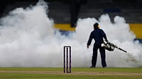 | Photo: AP/Eranga Jayawardena : Women's Cricket World Cup 2025: A worker fumigates the field during the ICC Women's Cricket World Cup match between India and Pakistan at Premadasa Stadium in Colombo.