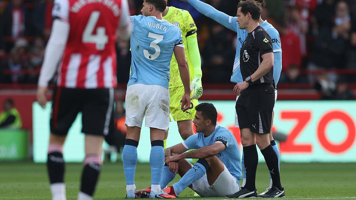 Manchester City's Rodri on the floor, before being taken off as injured, during the English Premier League soccer match between Brentford and Manchester City at the Gtech Community Stadium, Brentford, England, Sunday Oct. 5, 2025.