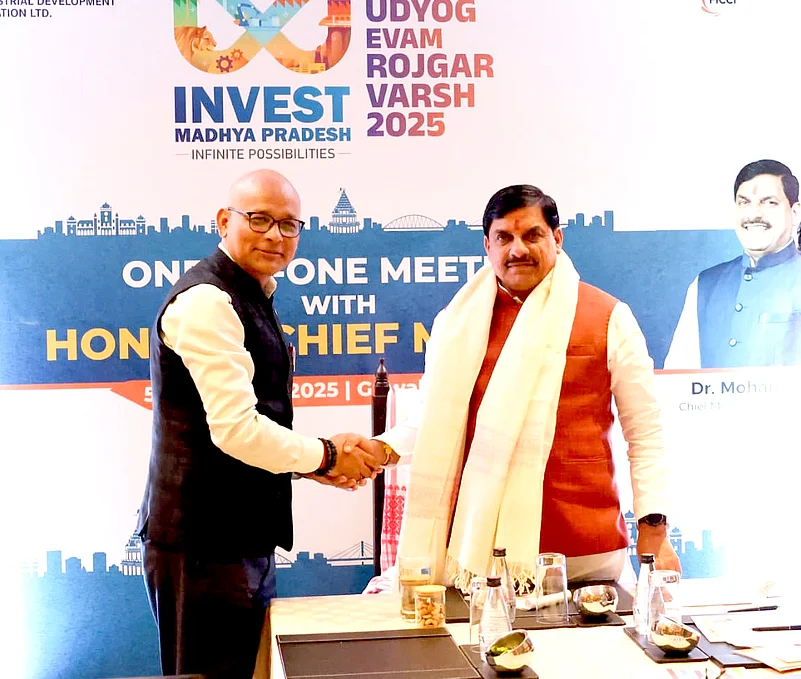 CM Dr. Mohan Yadav shaking hands with an industrialist