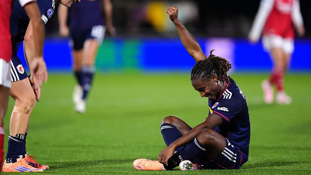 | Photo: AP/John Walton : OL Lyonnes' Melchie Dumornay celebrates scoring their side's second goal during the Women's Champions League soccer match between Arsenal and OL Lyonnes at Meadow Park, Borehamwood, England, Tuesday, Oct, 7, 2025. 