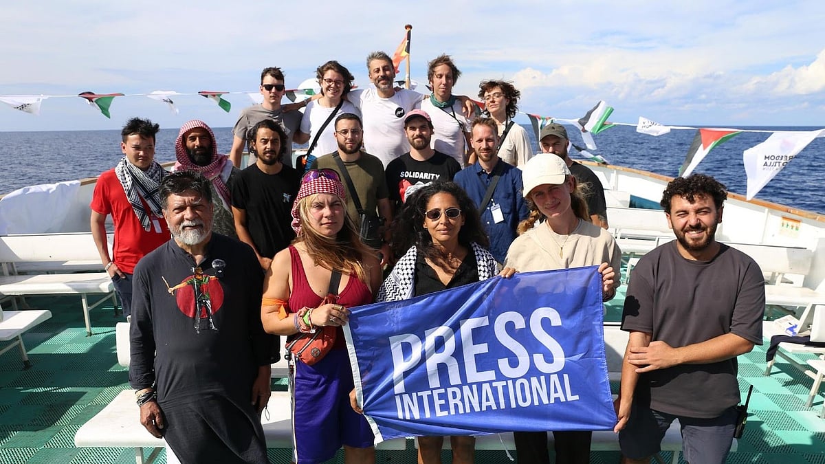 Photo by Ashram: International media on board the Conscience.  : Bangladeshi photographer and activist Shahidul Alam (bottom left) on board the Conscience. 