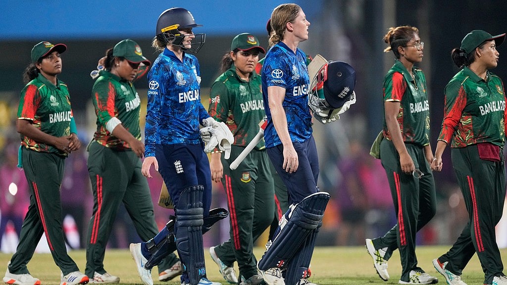 AP : England's Heather Knight and Charlotte Dean, centre, walk off the field after winning the ICC Women's Cricket World Cup match against Bangladesh at Barsapara Cricket Stadium in Guwahati.