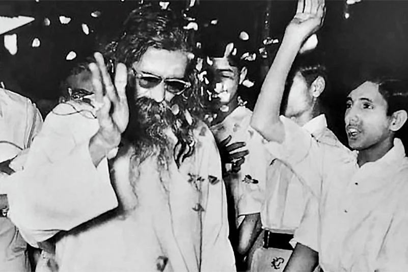 M.S. Golwalkar being greeted by young RSS members