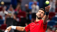 Novak Djokovic in action against Zizou Bergs