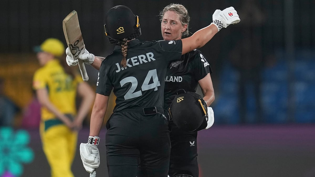 | Photo: AP/Rafiq Maqbool : New Zealand's captain Sophie Devine, right, is congratulate by New Zealand's Jess Kerr after scoring century during the ICC Women's Cricket World Cup cricket match between New Zealand and Australia at Holkar Cricket Stadium in Indore,India, Wednesday, Oct. 1, 2025.