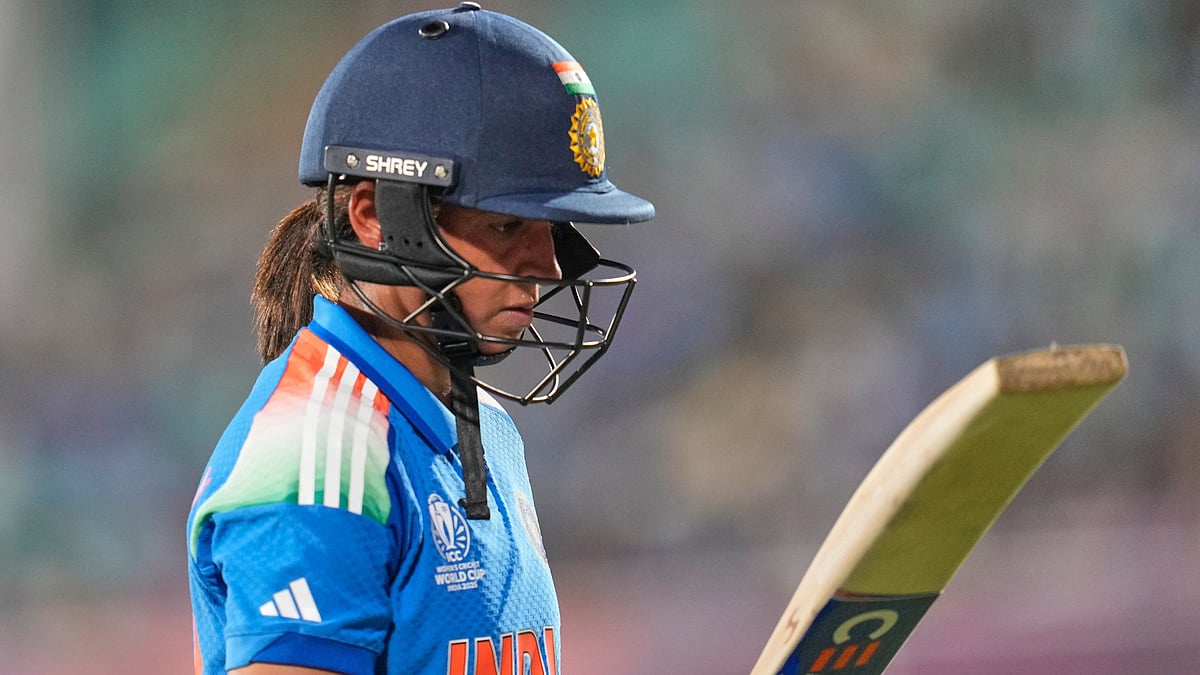 | Photo: AP/Aijaz Rahi : India's captain Harmanpreet Kaur reacts as she walks off the field after losing her wicket during the ICC Women's Cricket World Cup match between India and South Africa at ACA-VDCA Cricket Stadium in Visakhapatnam, India, Thursday, Oct. 9, 2025.