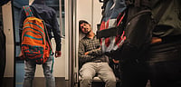 Shutterstock : Man sleeping in a metro