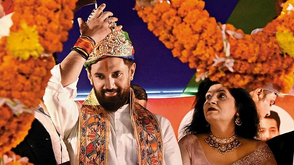 | Photo: Getty Images : Political Game: Chirag Paswan being honoured during the foundation day of his party in Patna  