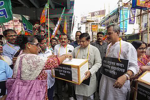 BJP activists collect flood relief funds for North Bengal victims