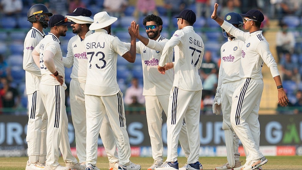 AP : India's Ravindra Jadeja, centre, celebrates the dismissal of West Indies' captain Roston Chase with teammates on the second day of the second Test at the Arun Jaitley Stadium in New Delhi.