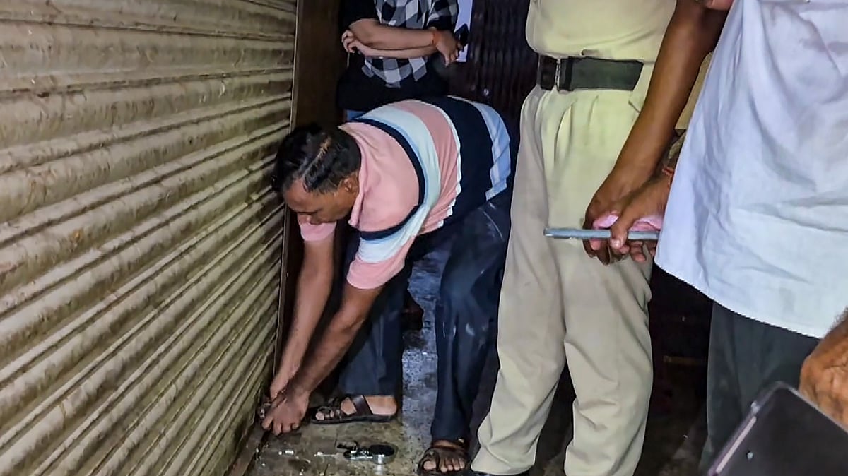 | PTI : Officials seal office of a firm, that allegedly supplied Coldrif cough syrup, after a raid, in Jabalpur, Madhya Pradesh, Sunday, Oct. 5, 2025. The Madhya Pradesh police have formed a special investigation team (SIT) to probe the death of 14 children in Chhindwara due to suspected renal failure, linked to the consumption of a 'toxic' cough syrup, officials said on Sunday. 
