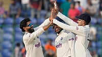Photo: AP : India Vs West Indies, 2nd Test, Day 2: Ravindra Jadeja celebrates the dismissal of Roston Chase with captain Shubman Gill in Delhi.