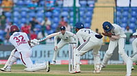 (AP Photo/Manish Swarup) : India's Sai Sudharsan, right, reacts in pain after taking the catch of West Indies' John Campbell, left, hurting his little finger on the second day of the second cricket test match between India and West Indies at the Arun Jaitley Stadium in New Delhi, India, Saturday, Oct.11, 2025.