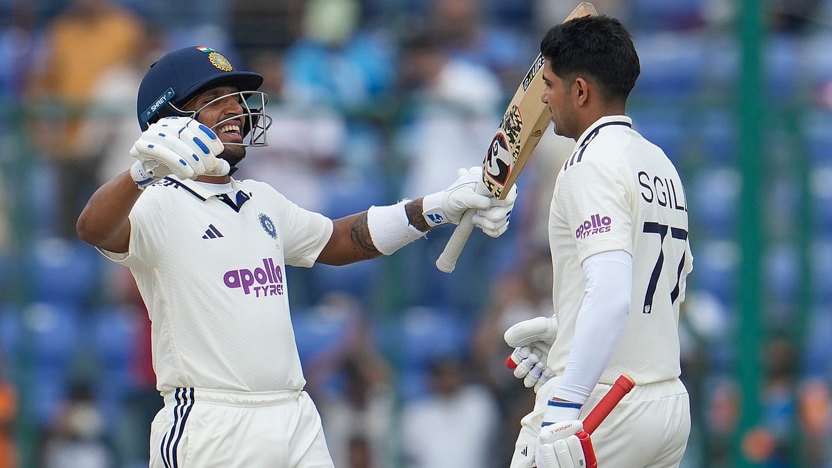 | Photo; AP/Manish Swarup : India's wicketkeeper Dhruv Jurel hugs captain Shubman Gill on later's scoring a century on the second day of the second cricket test match between India and West Indies at the Arun Jaitley Stadium in New Delhi, India, Saturday, Oct.11, 2025. 