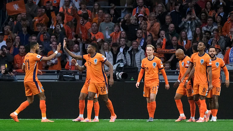 The Netherlands players celebrate after Donyell Malen, 3rd right, scored the opening goal during a World Cup 2026 group G qualifying soccer match between the Netherlands and Finland in Amsterdam, Sunday, Oct. 12, 2025.  - | Photo: AP/Patrick Post