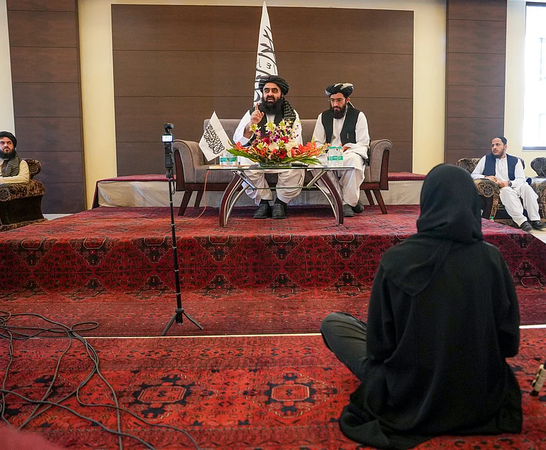 Afghanistan Foreign Minister Amir Khan Muttaqi, left, addresses a press conference, in New Delhi, Sunday, Oct. 12, 2025. - PTI