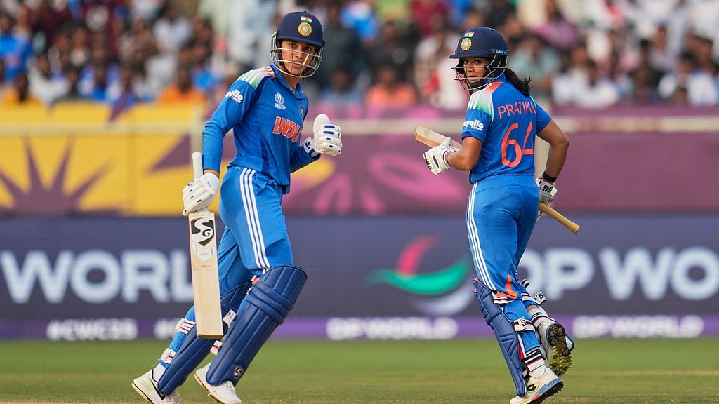 Aijaz Rahi : India's Smriti Mandhana, left, and batting partner Pratika Rawal run between the wickets during the ICC Women's Cricket World Cup match against Australia at ACA-VDCA Cricket Stadium in Visakhapatnam.