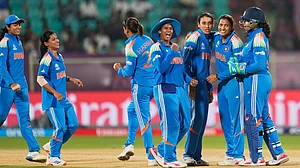 Photo: AP : Team India celebrating a wicket during their game against Australia in the ICC Women's Cricket World Cup 2025
