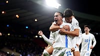| Photo: AP/Andrew Milligan : Greece's Kostas Tsimikas, front, celebrates with teammates after the opening goal during the World Cup 2026 group C qualifying soccer match between Scotland and Greece at Hampden Park in Glasgow, Scotland, Thursday, Oct. 9, 2025.