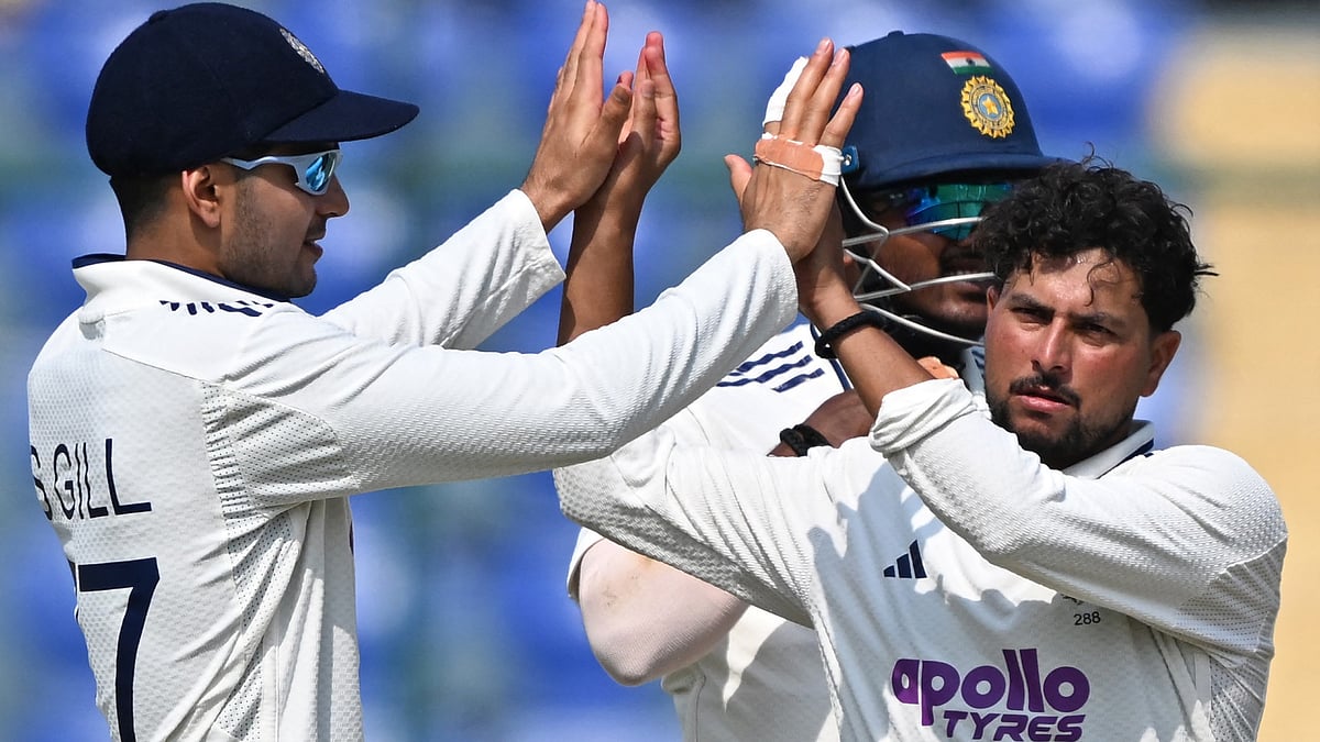 Shubman Gill and Kuldeep Yadav celebrate the wicket of Tevin Imlach