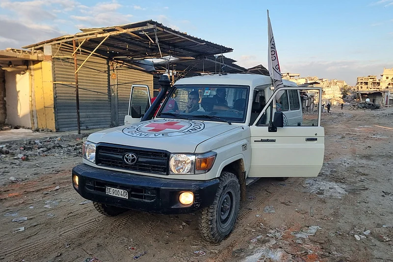 Israel Hamas Gaza war- Hostage release _A Red Cross vehicle