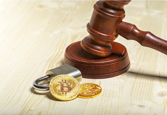 Gavel with padlock and Bitcoin coins symbolizing crypto regulation and security.