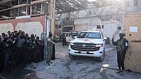 | IMAGO / Anadolu Agency : Hamas members hand over some of the 20 Israeli hostages to International Committee of the Red Cross (ICRC) teams as part of the ceasefire and hostage-prisoner exchange agreement between Hamas and Israel on October 13, 2025 in Gaza City, Gaza.