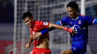 | Photo: Instagram/theanfaofficial : Nepal player in action against Vietnam during their AFC Asian Cup 2027 Qualifiers match on October 9, 2025.