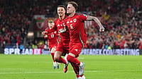 | Photo: AP/Adam Davy : Wales' Joe Rodon celebrates scoring the first goal of the game during the World Cup European Qualifying soccer match between Wales and Belgium at the Cardiff City Stadium in Cardiff, Monday, Oct. 13, 2025. 