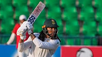 (AP Photo/K.M. Chaudary) : South Africa's Tony dy Zorzi bats during the second day of the first test cricket match between Pakistan and South Africa, in Lahore, Pakistan, Monday, Oct. 13, 2025. 